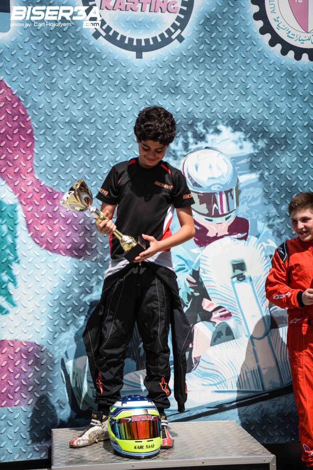 Karl Saad crossing the finish area and celebrating on track